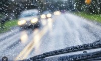 Vintage car drive on rainy hill road